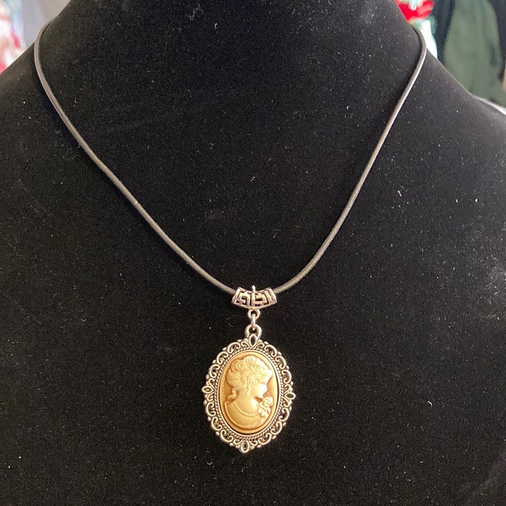 Gorgeous cameo necklace on approximately 8” closed nylon slider  style